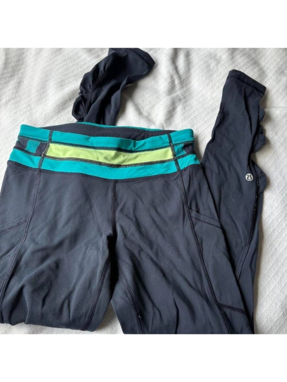 Lululemon align leggings with teal, lime green, and black horizontal stripes
